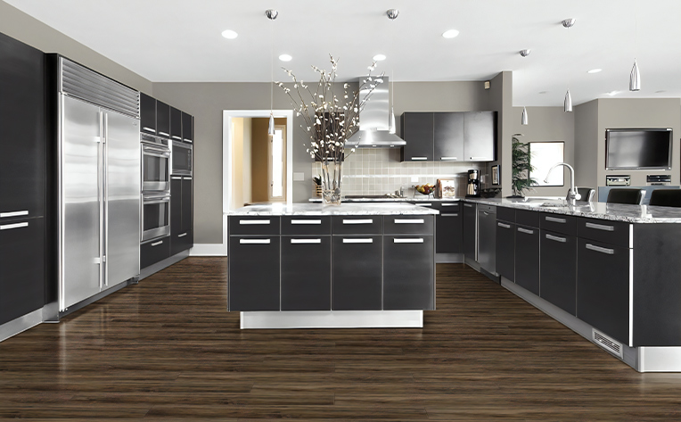 kitchen with brown vinyl flooring and white backsplash