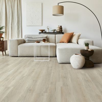 LVP floors in a stylish living room with couch and lamp